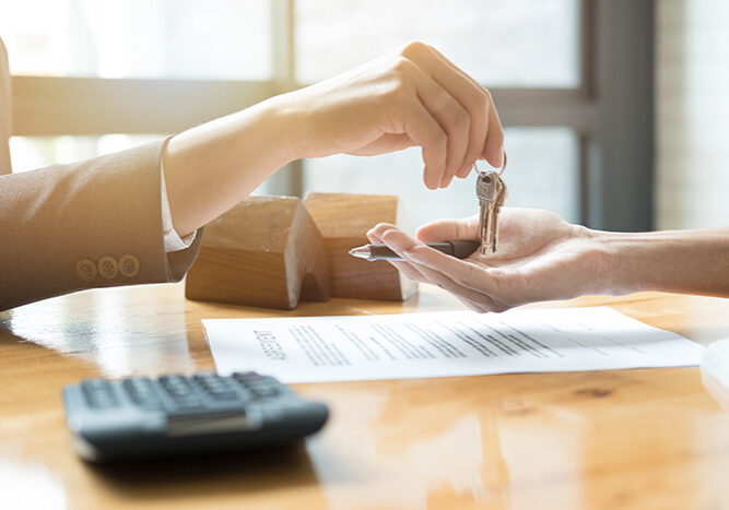 Estate,Agent,Giving,House,Keys,To,Man,And,Sign,Agreement estate agent giving house keys to man and sign agreement in office